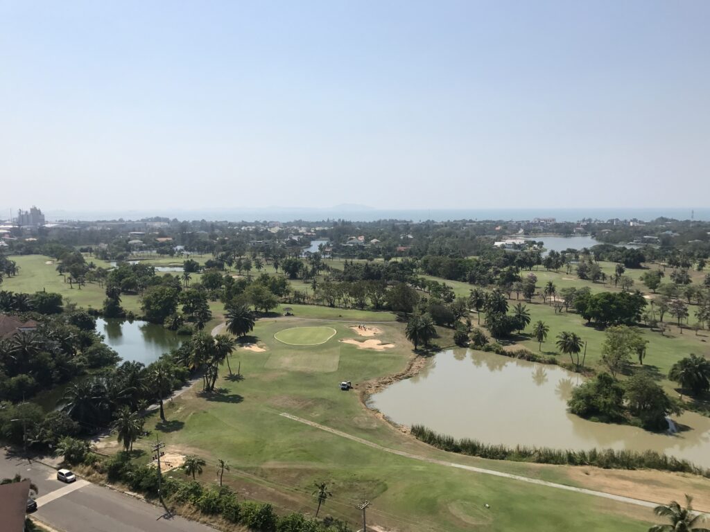 Picture of Dog leg to the right golf fairway with a water hazard in the crook of the leg
