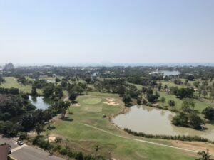 Picture of Dog leg to the right golf fairway with a water hazard in the crook of the leg